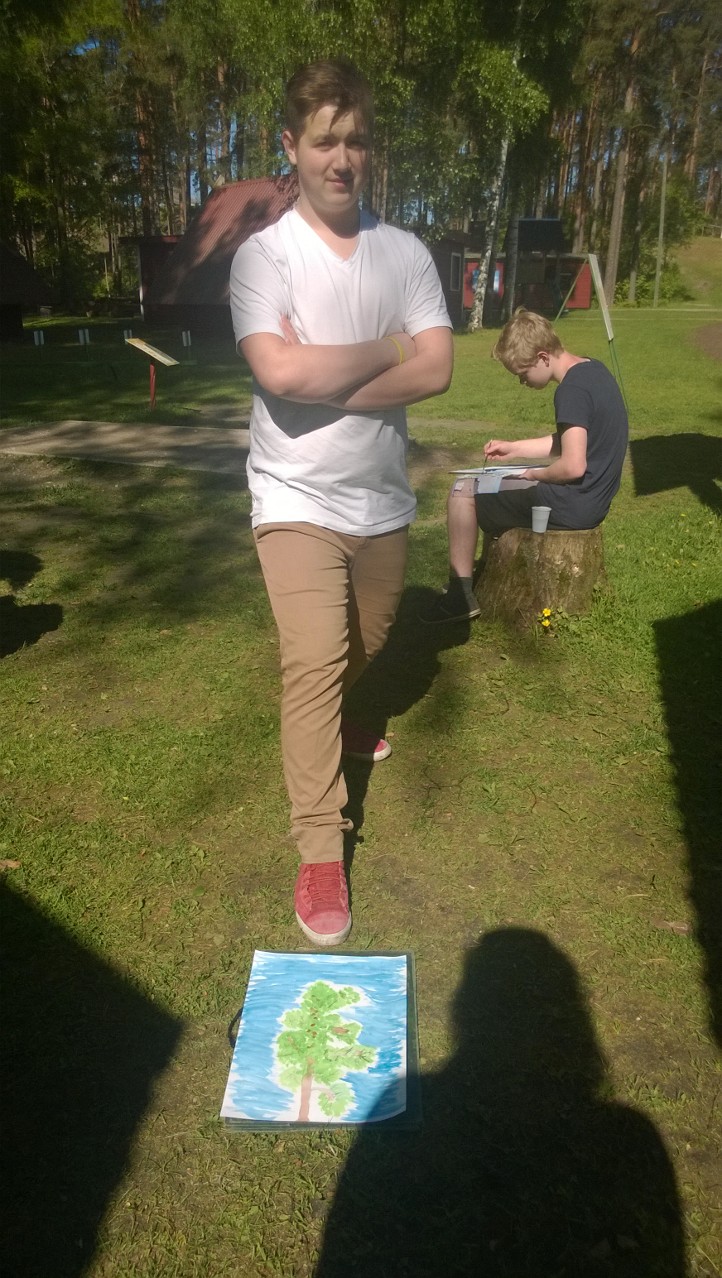 Mikolaj með sitt verk í vatnslitamálun